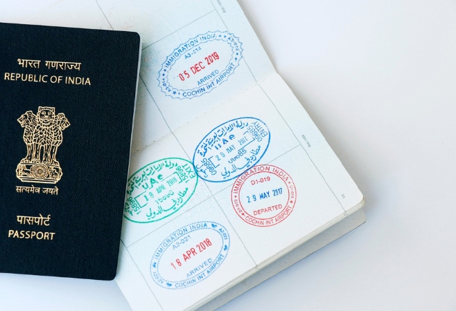 United Arab Emirates and Indian official stamps on a passport page