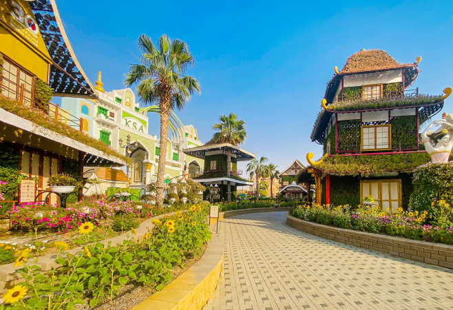 Family enjoying outdoor winter attractions at Global Village in Dubai