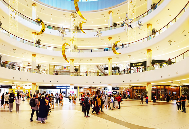 Luxury travelers shopping near Dubai Mall and staying at premium hotels in Downtown Dubai
