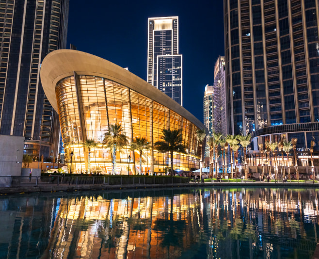 Night view of the Dubai Opera near the Burj Khalifa Tower at night