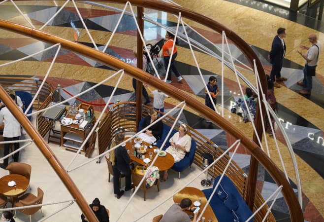 Tourists enjoying a weekend brunch experience at a Dubai restaurant